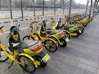 Electric bikes for share are placed along a street in Beijing. (Photo/Beijing Morning Post)