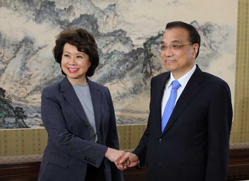 Premier Li Keqiang shakes hands with US Secretary of Transportation Elaine Chao at the Zhongnanhai leadership compound in Beijing on Thursday. Chao congratulated Li on China's economic performance in continuing to maintain a high growth rate. She also said she hopes the two nations will reach a positive outcome in trade and economic talks. (Photo/China Daily)